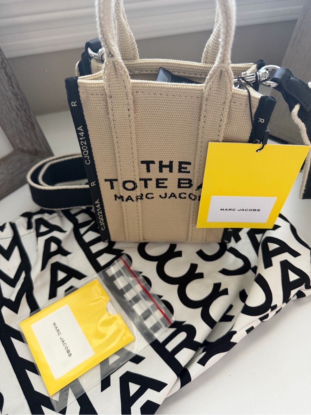 Marc Jacobs Beige Mini Canvas The Tote Bag with Black Accents and Yellow Tag
